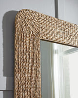 Ashley Furniture Norigan floor mirror with a sleek, full-length glass surface and modern frame for stylish home decor.