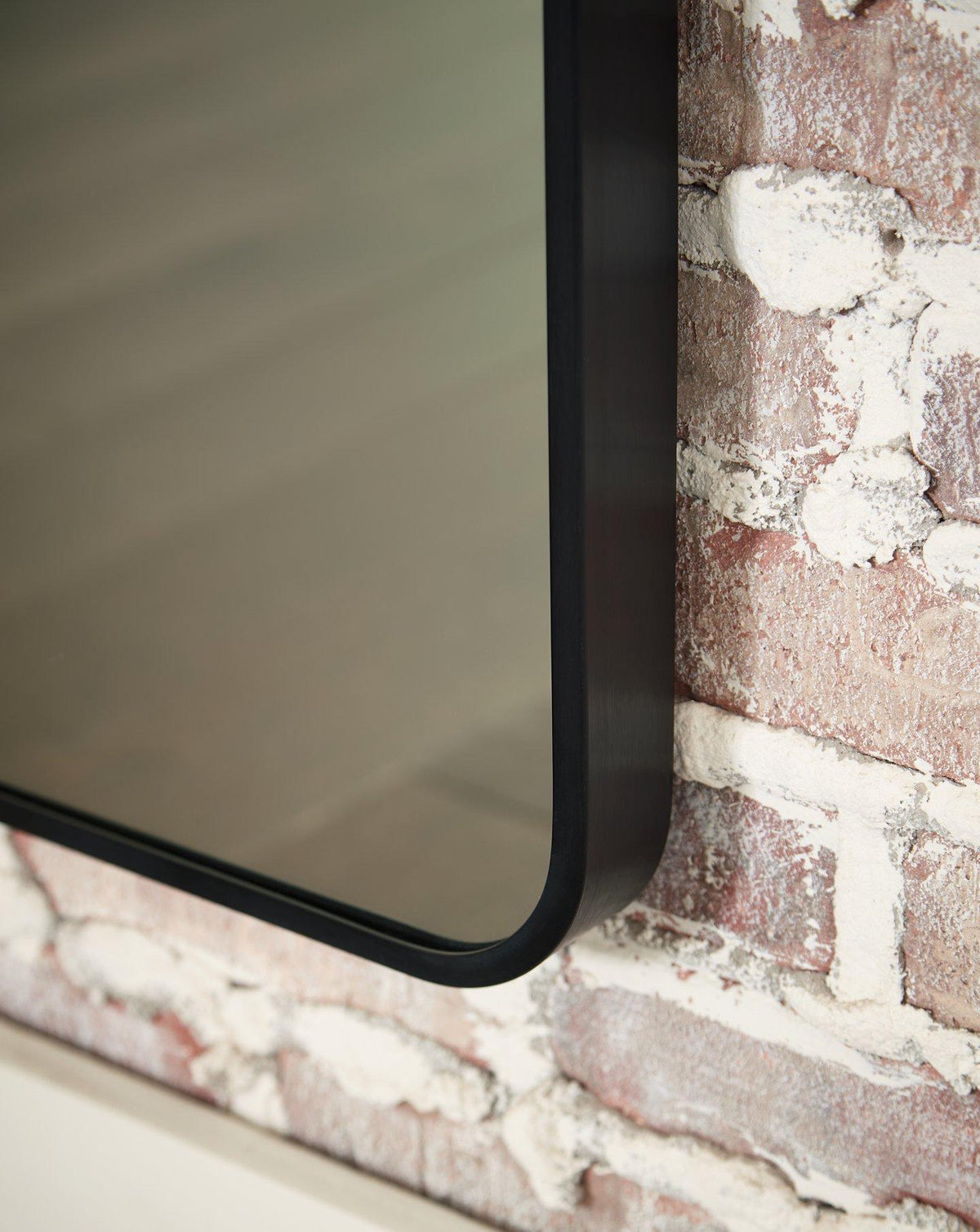 Ashley Furniture Sethall floor mirror reflecting a sleek, modern full-length mirror with a sturdy frame.