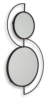 Ashley Furniture Shayham accent mirror with a sleek frame, hanging on a wall in a modern living space.