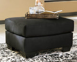 Ashley Furniture Darcy Ottoman with soft fabric upholstery and a versatile, stylish design for living room decor.