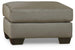 Ashley Furniture Darcy Ottoman with plush fabric and tufted top, ideal for living room or bedroom decor.