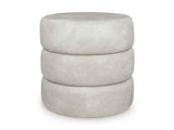 Ashley Furniture Ummi Swivel Accent Ottoman with plush fabric and modern design, shown in a cozy living room setting.