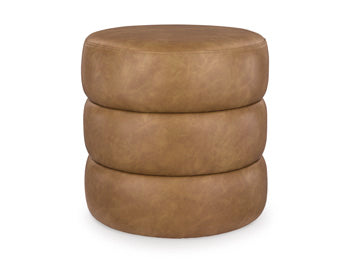 Ashley Furniture Ummi Swivel Accent Ottoman with plush fabric and modern design, shown in a stylish living room setting
