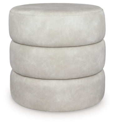 Ashley Furniture Ummi Swivel Accent Ottoman with cushioned top and wooden base, ideal for living room decor and extra seating.