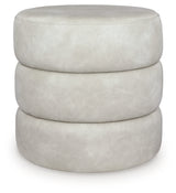Ashley Furniture Ummi Swivel Accent Ottoman with cushioned top and wooden base, ideal for living room decor and extra seating.