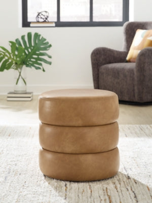 Ashley Furniture Ummi Swivel Accent Ottoman with plush fabric and a modern design, perfect for stylish living room seating.
