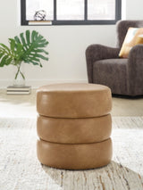 Ashley Furniture Ummi Swivel Accent Ottoman with plush fabric and a modern design, perfect for stylish living room seating.