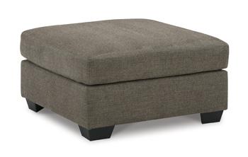 Oversized Mahoney accent ottoman by Ashley Furniture with soft fabric and plush cushioning, placed in a modern living room setting.