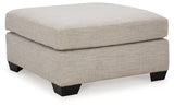 Mahoney oversized accent ottoman by Ashley Furniture with plush fabric and modern design in a cozy living room setting.