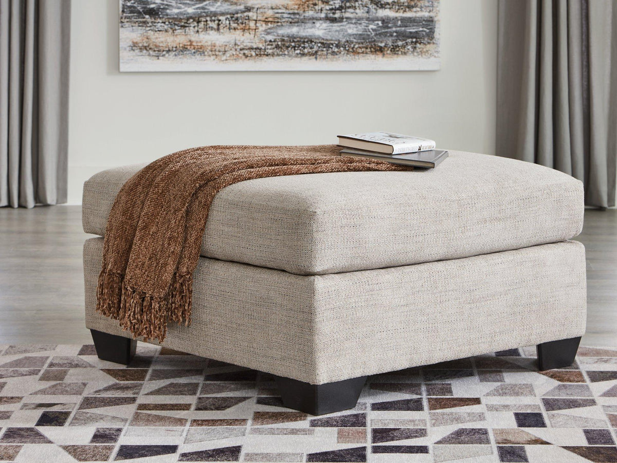 Ashley Furniture Mahoney oversized accent ottoman with soft fabric upholstery, designed for stylish living room decor.