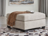 Ashley Furniture Mahoney oversized accent ottoman with soft fabric upholstery, designed for stylish living room decor.