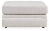 Ashley Furniture Adda Ottoman with plush fabric, featuring a soft, cushioned top and wooden legs for versatile living room seating.