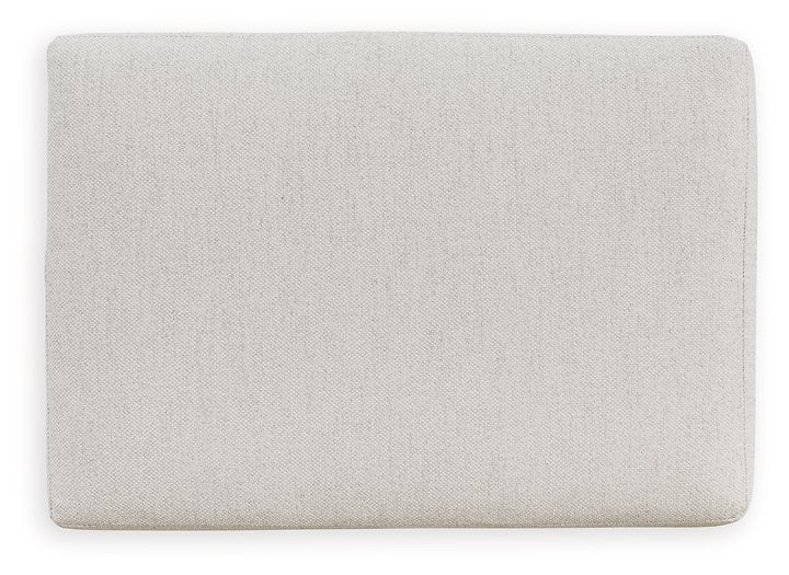 Adda Ottoman by Ashley Furniture featuring a plush, upholstered top and wooden legs for stylish comfort and versatile use.