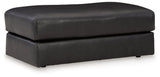 Ashley Furniture Amiata Ottoman with dark wood legs and upholstered fabric top, perfect for living room seating or decor.