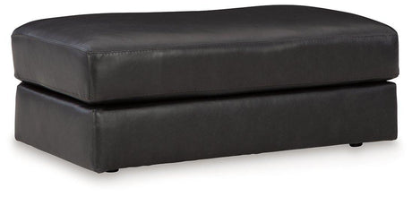 Ashley Furniture Amiata Ottoman with dark wood legs and upholstered fabric top, perfect for living room seating or decor.