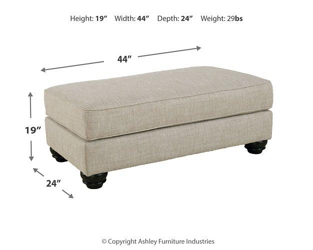 Ashley Furniture Asanti Ottoman, plush upholstered ottoman with wooden legs, designed for stylish living room decor.
