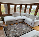 Ashley Furniture Atlas Cloud oversized ottoman with plush fabric and modern design, perfect for living room decor.
