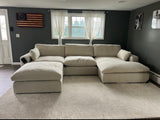 Large Atlas Cloud Oversized Ottoman from Ashley Furniture, soft fabric upholstery and plush cushion for versatile living room decor.