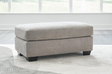 Ashley Furniture Avenal Park Ottoman, beige fabric upholstered with wooden legs, versatile storage and seating.