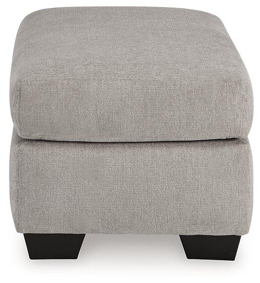 Avenal Park Ottoman by Ashley Furniture featuring a cushioned top and wooden legs in a neutral fabric finish.
