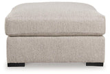 Ashley Furniture Ballyton oversized accent ottoman with plush fabric and sturdy wooden legs, ideal for living room decor.