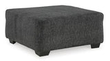 Oversized Ashley Furniture Biddeford Accent Ottoman with plush fabric and sturdy wooden legs, ideal for living room decor.