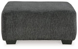 Oversized Ashley Furniture Biddeford Accent Ottoman with plush fabric and sturdy wooden legs, perfect for living room decor.