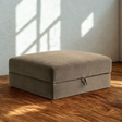 Ashley Furniture Corbin Storage Ottoman, beige fabric with cushioned top and built-in storage compartment, ideal for living room use.
