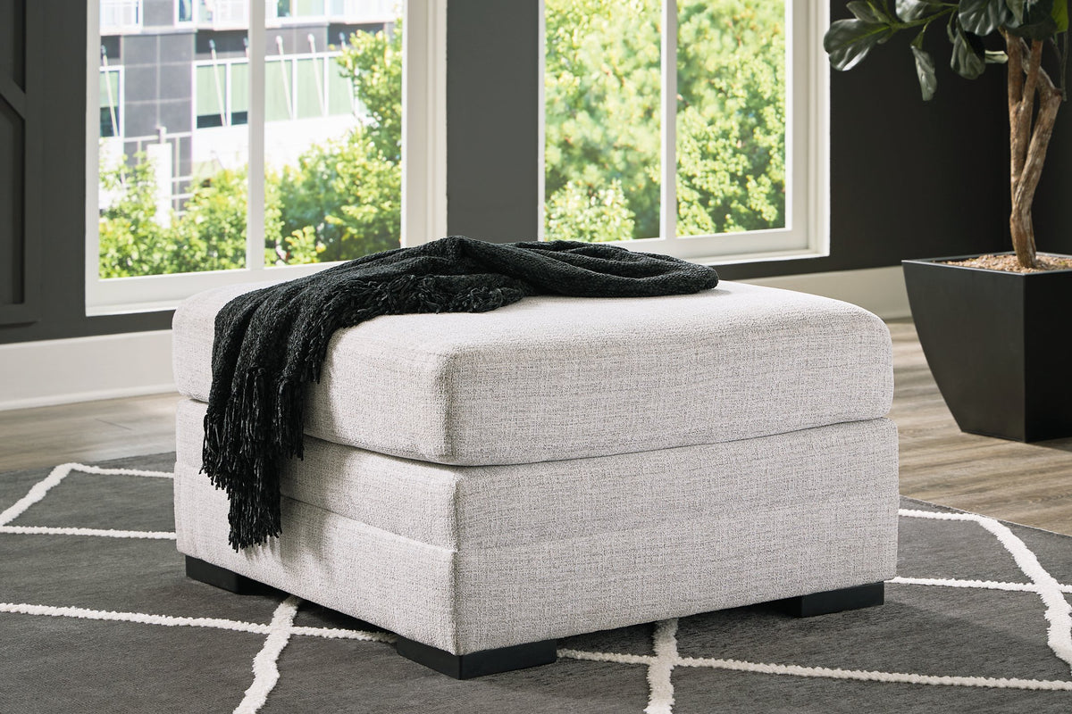 Ashley Furniture Koralynn oversized accent ottoman with fabric upholstery and plush cushion, shown in a modern living room setting.