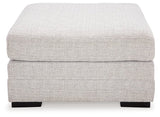 Ashley Furniture Koralynn oversized accent ottoman with fabric upholstery and plush cushioning, shown from a front head-on view.