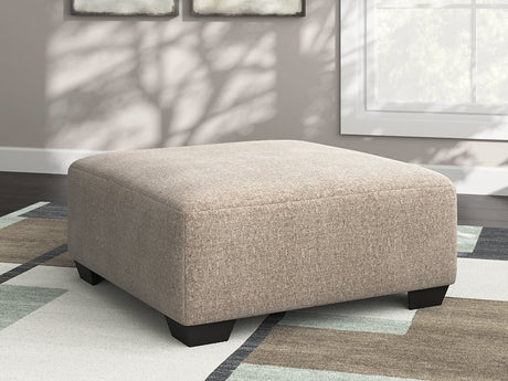 Ashley Furniture Newellen oversized accent ottoman with soft fabric upholstery and a plush top, ideal for living room decor.