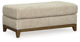 Ashley Furniture Parklynn Ottoman showing a plush, upholstered fabric with a simple, elegant design suitable for living room decor.