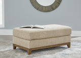 Ashley Furniture Parklynn Ottoman with plush fabric and wooden legs, showcasing a stylish, versatile storage and seating piece.
