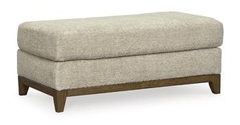 Ashley Furniture Parklynn Ottoman featuring a cushioned top and wooden legs, ideal for living room decor and extra seating.