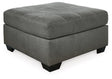 Ashley Furniture Pitkin oversized accent ottoman with soft fabric upholstery and sturdy wooden legs, ideal for living room decor.