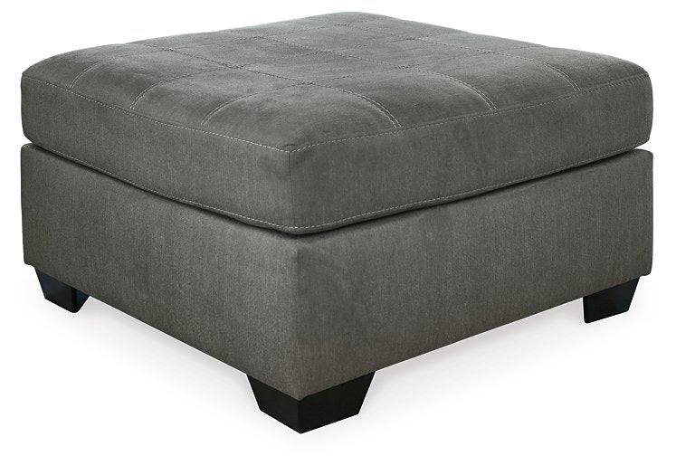 Ashley Furniture Pitkin oversized accent ottoman with soft fabric upholstery and sturdy wooden legs, ideal for living room decor.