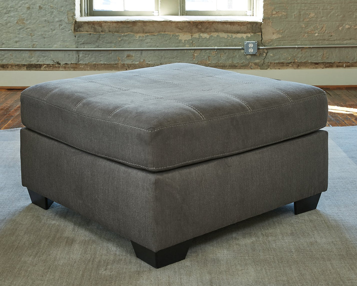 Ashley Furniture Pitkin oversized accent ottoman with plush fabric and sturdy wooden legs, perfect for living room decor.