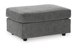 Ashley Furniture Stairatt Ottoman in neutral fabric, showcasing its plush, versatile design suitable for living room or bedroom decor.