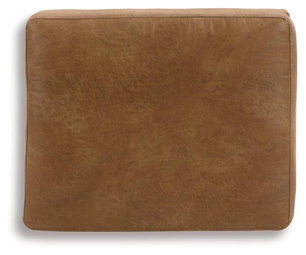 Ashley Furniture Telora Ottoman with fabric upholstery, featuring a cushioned top and wooden legs for versatile living room seating.