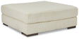 Lindyn oversized accent ottoman by Ashley Furniture with plush fabric and tufted top, serving as a stylish footrest or accent piece.