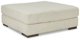 Lindyn oversized accent ottoman by Ashley Furniture with plush fabric and tufted top, serving as a stylish footrest or accent piece.