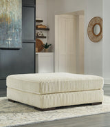 Ashley Furniture Lindyn oversized accent ottoman with soft fabric upholstery and plush cushioning in a neutral color.