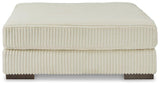 Lindyn oversized accent ottoman by Ashley Furniture featuring plush fabric and sturdy wooden legs in a modern design.