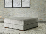 Lindyn oversized accent ottoman by Ashley Furniture with plush fabric and modern design, placed in a stylish living room setting.