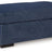 Ashley Furniture Evansley Ottoman showing a plush fabric surface and wooden legs, ideal for living room or bedroom decor.