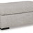 Ashley Furniture Evansley Ottoman showing a plush fabric surface with wooden legs, perfect for living room or seating area.