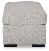 Ashley Furniture Evansley Ottoman with cushioned top and wooden legs, showcasing a stylish and versatile accent piece.