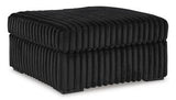 Oversized Midnight-Madness Ashley Furniture accent ottoman with plush fabric and modern design, perfect for living room decor.