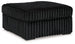 Oversized Midnight-Madness accent ottoman by Ashley Furniture with plush fabric and modern design, suitable for living rooms or seating areas.