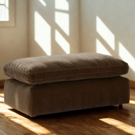 Sand-colored Ashley Furniture Nova Cloud Ottoman with soft fabric upholstery and a modern, plush design.
